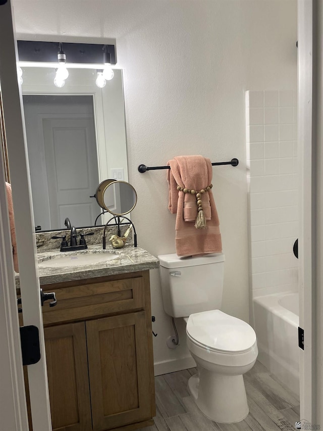 369 S 7th Ave, Yuma, AZ 85364 - bathroom featuring toilet, vanity, wood finished floors, and baseboards