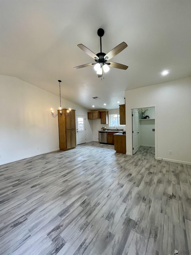 369 S 7th Ave, Yuma, AZ 85364 - unfurnished living room with a ceiling fan, a chandelier, light wood finished floors, baseboards, and recessed lighting
