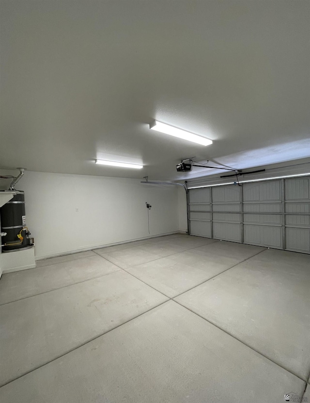 369 S 7th Ave, Yuma, AZ 85364 - garage featuring a garage door opener and strapped water heater