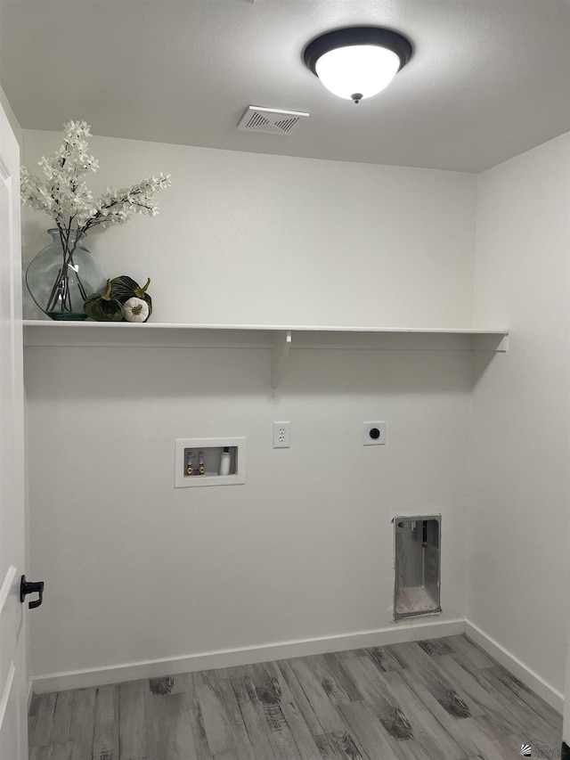 369 S 7th Ave, Yuma, AZ 85364 - laundry area featuring hookup for a washing machine, wood finished floors, electric dryer hookup, and baseboards