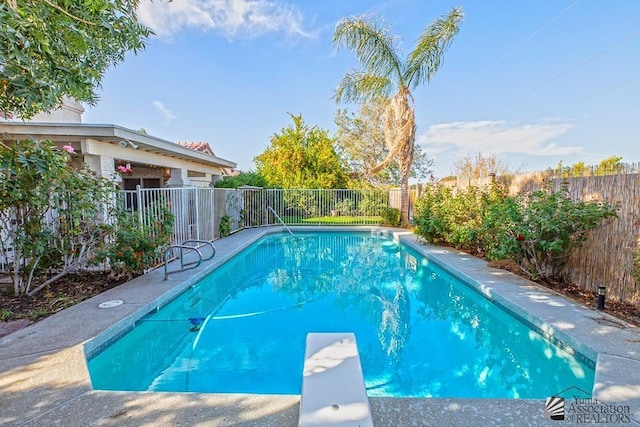 11546 E Via Montana, Yuma, AZ 85367 - view of pool featuring a diving board, a fenced in pool, and a fenced backyard