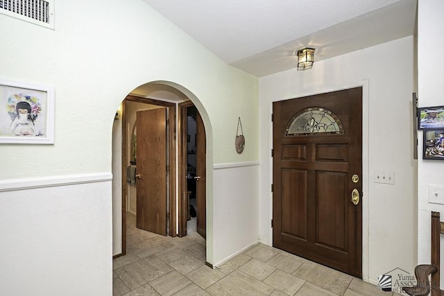 11546 E Via Montana, Yuma, AZ 85367 - foyer entrance with arched walkways, light tile patterned flooring, and visible vents