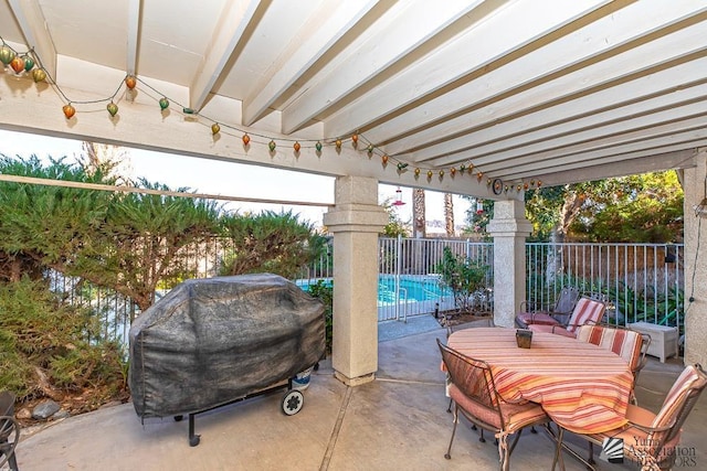 11546 E Via Montana, Yuma, AZ 85367 - view of patio featuring grilling area, a fenced in pool, a fenced backyard, and outdoor dining space