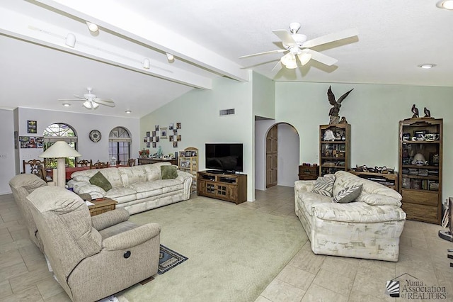 11546 E Via Montana, Yuma, AZ 85367 - living room with ceiling fan, visible vents, arched walkways, lofted ceiling with beams, and light tile patterned flooring