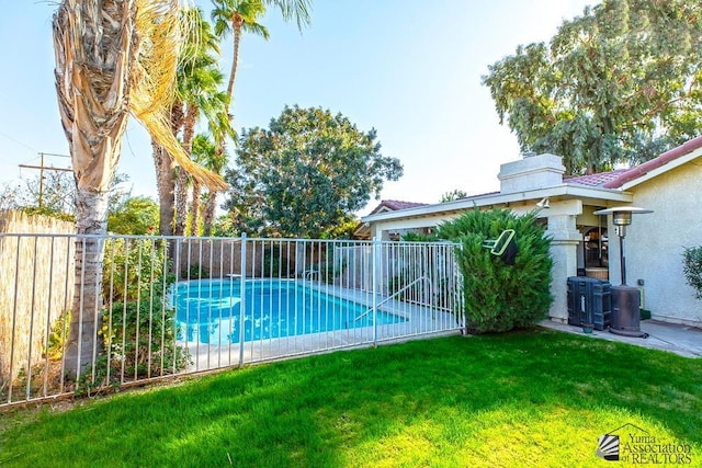 11546 E Via Montana, Yuma, AZ 85367 - view of pool with a fenced in pool, a fenced backyard, central AC, and a yard