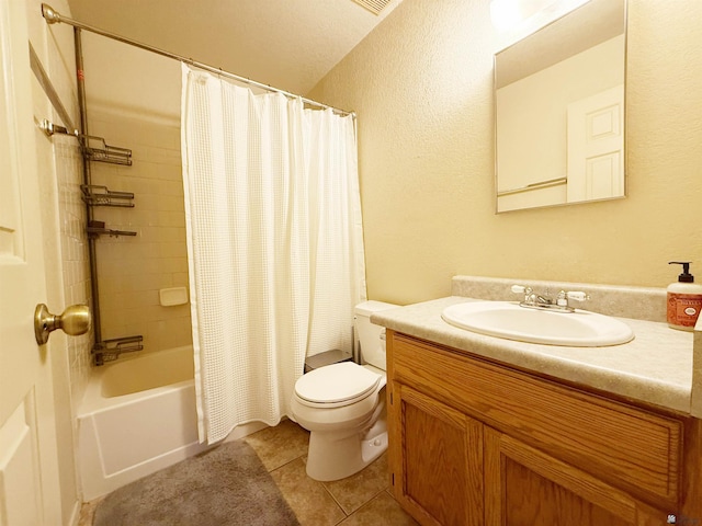 11451 E 27th Pl, Yuma, AZ 85367 - full bath featuring a textured wall, vanity, toilet, tile patterned floors, and shower / bath combo with shower curtain