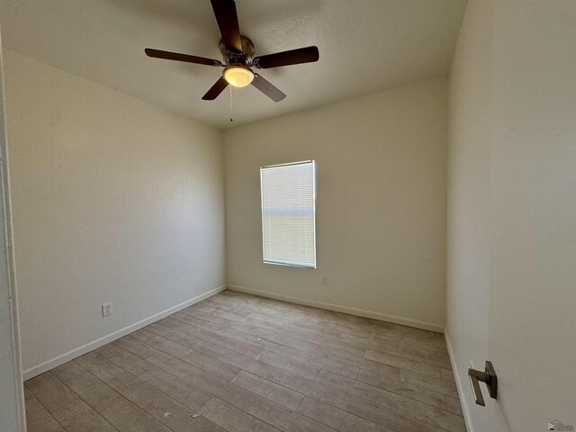 221 E Spring St, Somerton, AZ 85350 - spare room with wood finished floors, ceiling fan, and baseboards