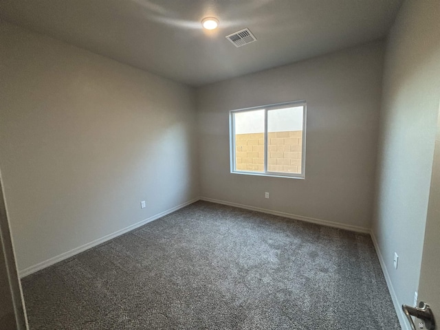unfurnished room featuring visible vents, baseboards, and carpet floors