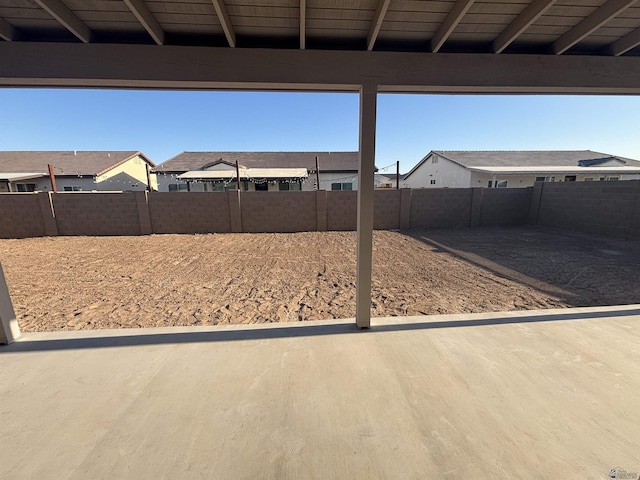 view of yard with a fenced backyard and a residential view