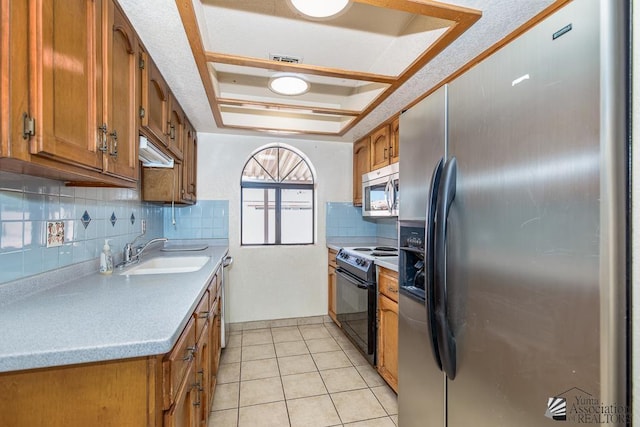 12344 E Calle Maria, Yuma, AZ 85367 - kitchen with brown cabinets, stainless steel appliances, a sink, and light countertops