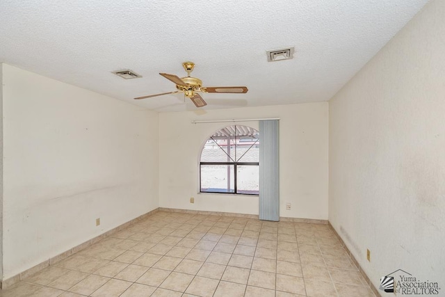 12344 E Calle Maria, Yuma, AZ 85367 - unfurnished room with a ceiling fan, light tile patterned flooring, a textured ceiling, and visible vents
