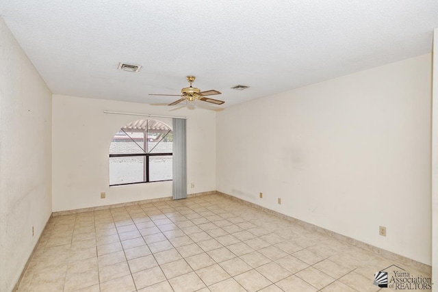 12344 E Calle Maria, Yuma, AZ 85367 - spare room featuring a textured ceiling, ceiling fan, and visible vents