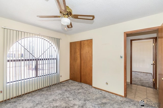 12344 E Calle Maria, Yuma, AZ 85367 - unfurnished bedroom featuring carpet flooring, baseboards, ceiling fan, and a closet