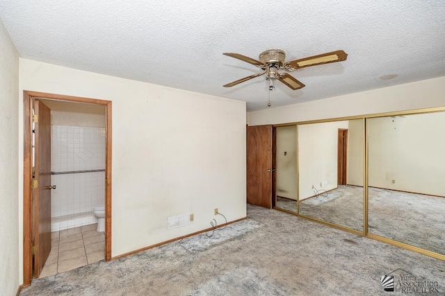 12344 E Calle Maria, Yuma, AZ 85367 - unfurnished bedroom featuring carpet, a closet, ensuite bath, and visible vents
