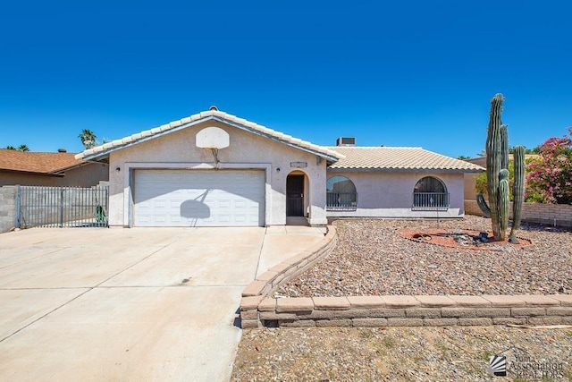 12344 E Calle Maria, Yuma, AZ 85367 - view of front of property featuring fence, stucco siding, a tiled roof, an attached garage, and driveway