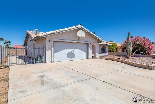 12344 E Calle Maria, Yuma, AZ 85367 - ranch-style house featuring a tile roof, a garage, fence, concrete driveway, and stucco siding