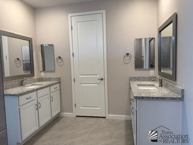 12373 S Drucilla Ln, Yuma, AZ 85367 - bathroom with two vanities and tile patterned flooring