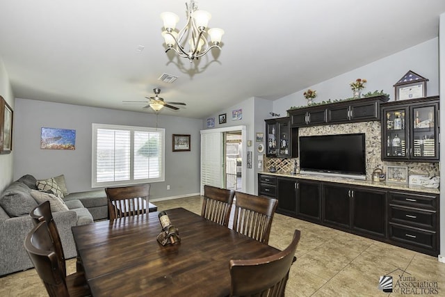 2793 S Aurora Ave, Yuma, AZ 85365 - dining room featuring ceiling fan, a chandelier, lofted ceiling, and baseboards