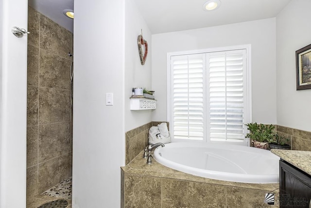 2793 S Aurora Ave, Yuma, AZ 85365 - bathroom featuring tiled shower, a bath, and vanity