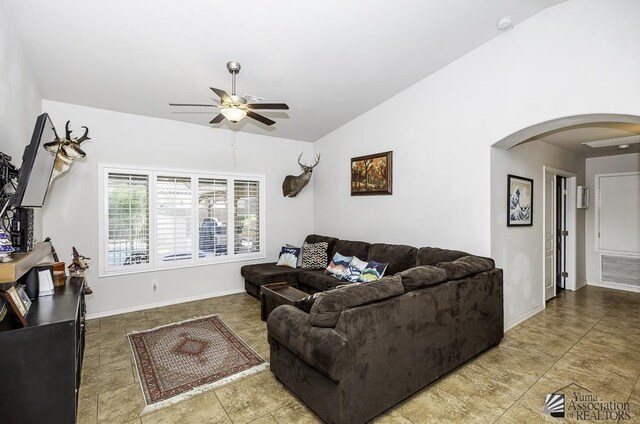 2793 S Aurora Ave, Yuma, AZ 85365 - living room with arched walkways, a ceiling fan, lofted ceiling, and baseboards