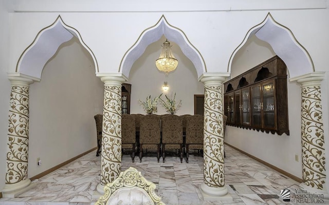 dining area featuring decorative columns