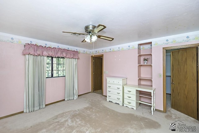 unfurnished bedroom featuring ceiling fan and light carpet