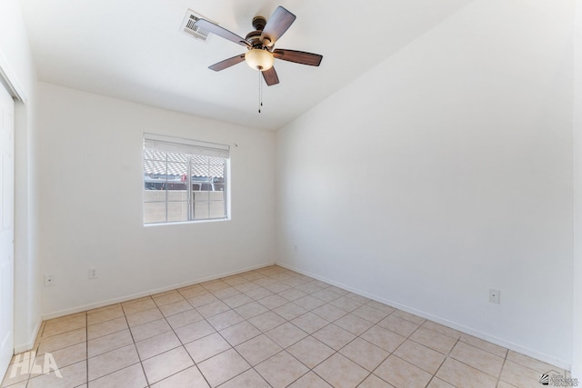 unfurnished room featuring visible vents, a ceiling fan, baseboards, and light tile patterned floors