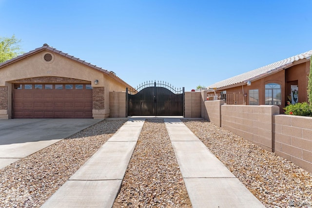 view of front facade featuring a garage, fence, stucco siding, a gate, and driveway