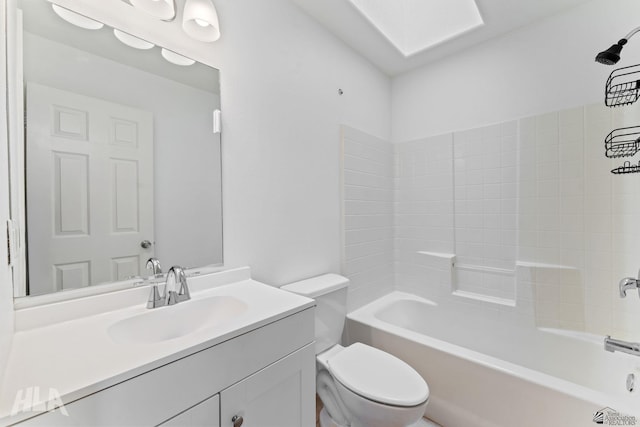 bathroom with vanity, shower / bathtub combination, and toilet