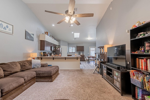 7309 E 37th Pl, Yuma, AZ 85365 - living room with ceiling fan, light carpet, and high vaulted ceiling