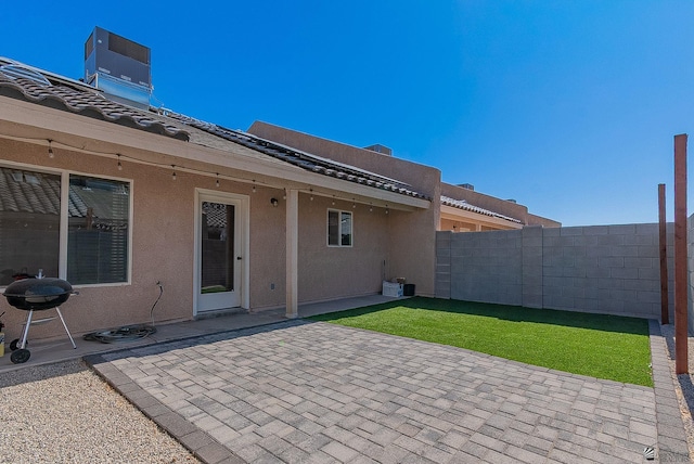 7309 E 37th Pl, Yuma, AZ 85365 - fenced backyard with a grill and a patio area