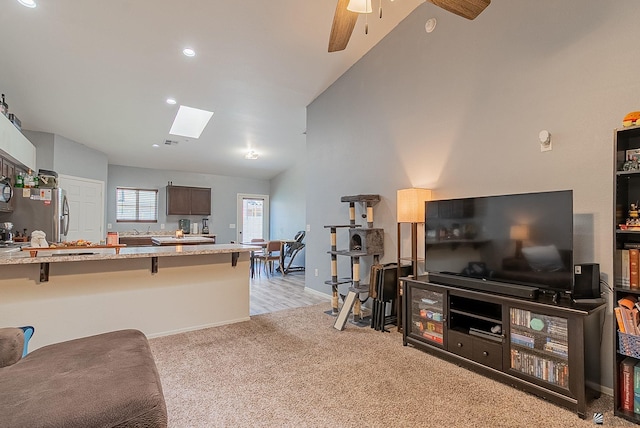 7309 E 37th Pl, Yuma, AZ 85365 - living room with a skylight, light colored carpet, ceiling fan, high vaulted ceiling, and recessed lighting