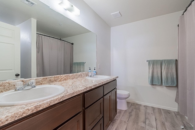 7309 E 37th Pl, Yuma, AZ 85365 - bathroom with wood finished floors and double vanity