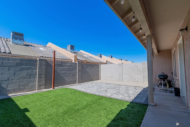 7309 E 37th Pl, Yuma, AZ 85365 - fenced backyard with a patio area