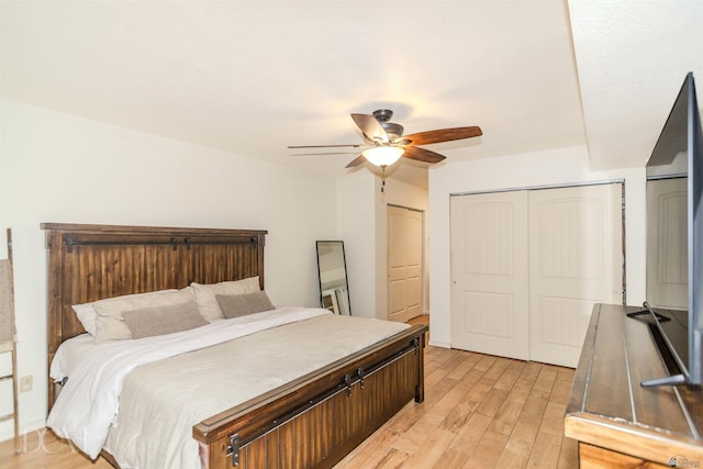 bedroom with ceiling fan and light wood finished floors