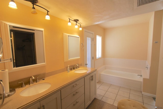 12459 E Del Rey Dr, Yuma, AZ 85367 - full bathroom with a sink, tile patterned floors, a garden tub, and visible vents