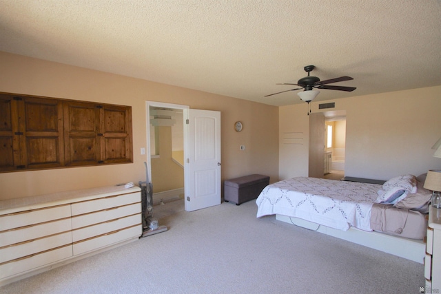 12459 E Del Rey Dr, Yuma, AZ 85367 - bedroom featuring visible vents, a ceiling fan, a textured ceiling, and light carpet