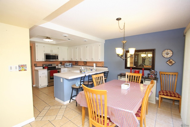 12459 E Del Rey Dr, Yuma, AZ 85367 - dining room with light tile patterned floors, baseboards, and an inviting chandelier