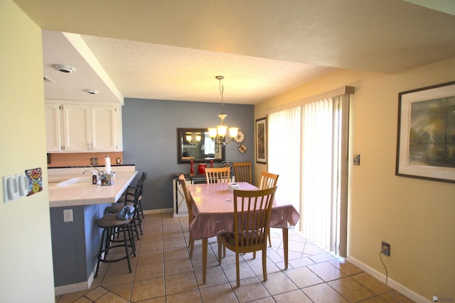 12459 E Del Rey Dr, Yuma, AZ 85367 - dining space featuring baseboards, a chandelier, and light tile patterned floors