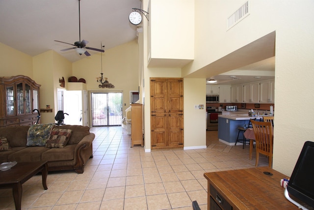12459 E Del Rey Dr, Yuma, AZ 85367 - living room featuring light tile patterned flooring, high vaulted ceiling, visible vents, and ceiling fan