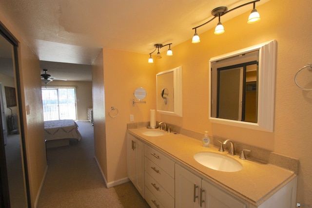 12459 E Del Rey Dr, Yuma, AZ 85367 - full bath with double vanity, a ceiling fan, a sink, and ensuite bath