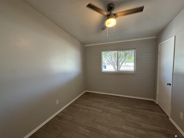 2641 S Las Palmas Vista Ave, Yuma, AZ 85364 - spare room featuring ceiling fan, dark wood finished floors, and baseboards