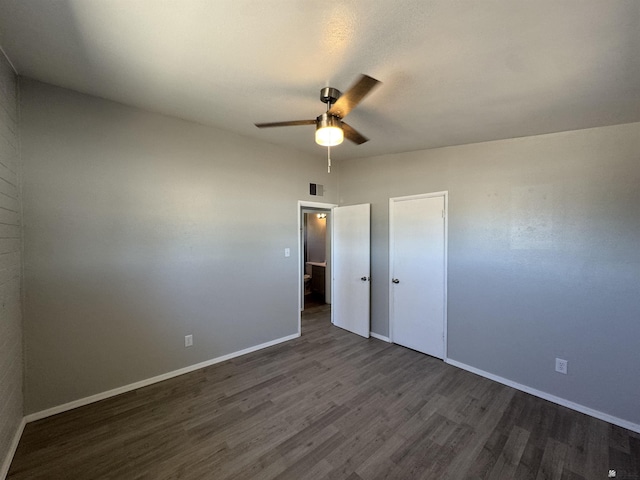 2641 S Las Palmas Vista Ave, Yuma, AZ 85364 - spare room with a ceiling fan, dark wood-style flooring, and baseboards