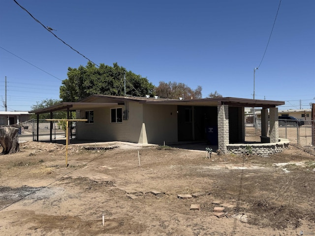 2641 S Las Palmas Vista Ave, Yuma, AZ 85364 - rear view of house featuring an attached carport