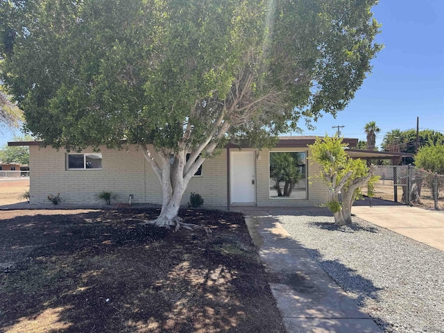 2641 S Las Palmas Vista Ave, Yuma, AZ 85364 - view of front of property with brick siding, a carport, and driveway