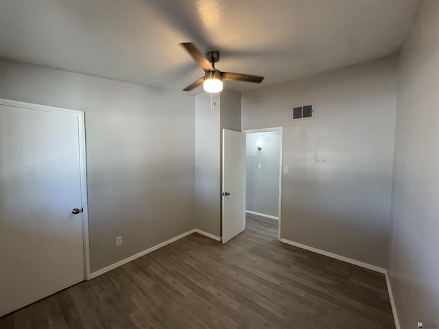 2641 S Las Palmas Vista Ave, Yuma, AZ 85364 - empty room featuring a ceiling fan, wood finished floors, and baseboards