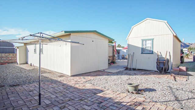 14359 E 28th Ln, Yuma, AZ 85367 - rear view of property featuring an outbuilding and a patio area