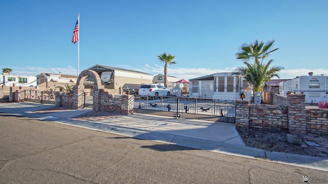 14359 E 28th Ln, Yuma, AZ 85367 - view of front of home with a residential view, a fenced front yard, and a gate