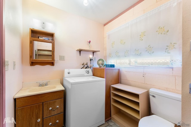29433 San Jose Ave, Wellton, AZ 85356 - bathroom with toilet, washer / dryer, and vanity