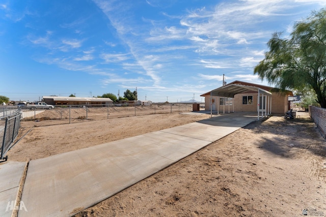 29433 San Jose Ave, Wellton, AZ 85356 - view of yard featuring a detached carport, fence, and driveway
